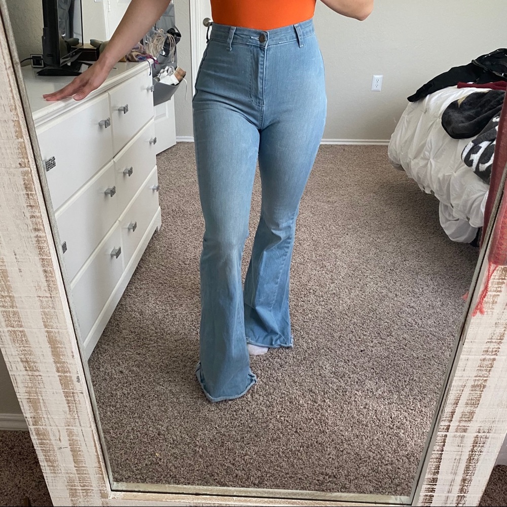 Light wash flare jeans with star detailing